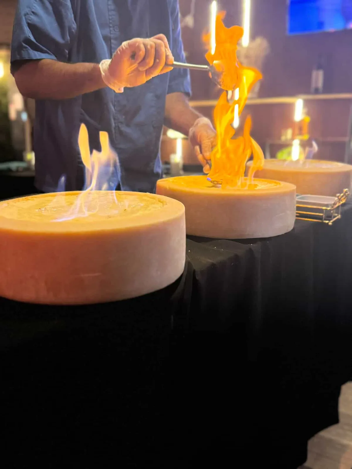 Tableside cheese wheel flambe at Blackstone on the Hill